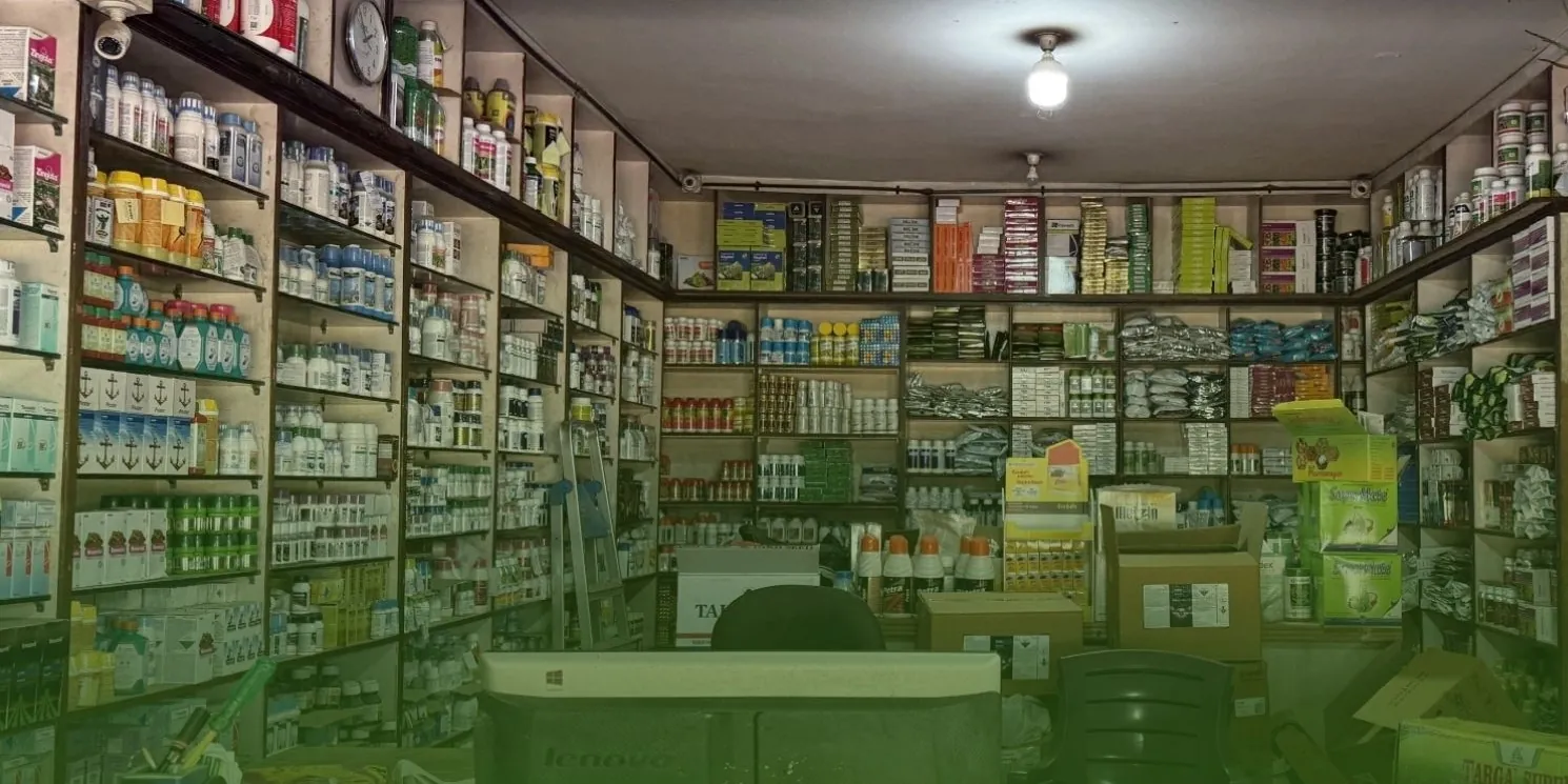 Shelves stocked with crop-protection products, seeds and fertilizers inside the KAC Traders store